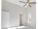 Bedroom with large ceiling fan and light fixture at 508 Sutters Mill Rd, Stone Mountain, GA 30087