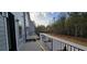 Wide angle of balcony shows railings and backyard area at 165 Brush Creek Ct, Hampton, GA 30281