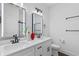 Bright bathroom featuring double sinks, modern fixtures, and illuminated mirrors for a sleek, contemporary feel at 165 Brush Creek Ct, Hampton, GA 30281