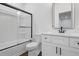 Modern bathroom with shower and tub, sleek vanity and fixtures at 165 Brush Creek Ct, Hampton, GA 30281