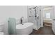 Bathroom featuring stand alone soaking tub, glass shower, and contemporary finishes at 165 Brush Creek Ct, Hampton, GA 30281
