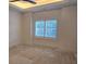 A bedroom with white walls, and plantation shutters on the window at 165 Brush Creek Ct, Hampton, GA 30281