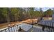 View from deck shows backyard with trees at 165 Brush Creek Ct, Hampton, GA 30281