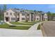 Charming brick townhomes with landscaped lawns, paved walkways and sidewalks at 165 Brush Creek Ct, Hampton, GA 30281
