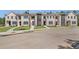 Brick townhomes offering manicured landscaping and convenient paved walkways at 165 Brush Creek Ct, Hampton, GA 30281