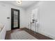 Bright foyer featuring dark hardwood floors, and modern decor at 165 Brush Creek Ct, Hampton, GA 30281