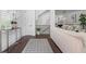 Inviting foyer with stylish rug, table and view to the living room and staircase at 165 Brush Creek Ct, Hampton, GA 30281