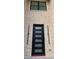Modern front door with sidelights set in a light brick facade at 165 Brush Creek Ct, Hampton, GA 30281