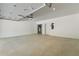 Spacious garage featuring ample space and doors to storage at 165 Brush Creek Ct, Hampton, GA 30281