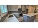 Modern kitchen featuring stainless steel appliances, shaker cabinets, island, and mosaic backsplash at 165 Brush Creek Ct, Hampton, GA 30281