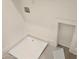 Bright laundry room with white trim, recessed lighting, and utility sink at 165 Brush Creek Ct, Hampton, GA 30281