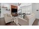 Bright living room featuring a sleek fireplace, a modern ceiling fan, and stylish decor at 165 Brush Creek Ct, Hampton, GA 30281