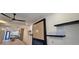 Spacious living room with fireplace feature wall, ceiling fan, and gray-tone kitchen visible at 165 Brush Creek Ct, Hampton, GA 30281