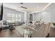 Cozy living room with sleek design, ceiling fan, and modern decor at 165 Brush Creek Ct, Hampton, GA 30281