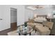A comfortable main bedroom is equipped with seating arrangements and complemented by natural lighting at 165 Brush Creek Ct, Hampton, GA 30281