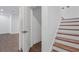 Staircase with wood treads and white risers leading to the next level of the home at 165 Brush Creek Ct, Hampton, GA 30281