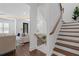 Elegant staircase with wooden treads and white risers, leading to the upper level of the home at 165 Brush Creek Ct, Hampton, GA 30281