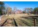 A home with a long driveway, a lawn, and a split rail fence at 355 Clark Creek Pass, Acworth, GA 30102