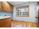 Laundry room with hardwood floors, cabinetry, and a large sink and lots of natural light at 355 Clark Creek Pass, Acworth, GA 30102