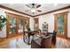 Home office with hardwood floors, natural lighting, and wood trim around the windows at 355 Clark Creek Pass, Acworth, GA 30102