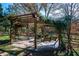 Outdoor retreat featuring a charming pergola with swing, perfect for relaxing at 355 Clark Creek Pass, Acworth, GA 30102