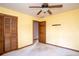 Spacious bedroom with ceiling fan and large closet at 714 Lanford Springs Sw Dr, Lilburn, GA 30047