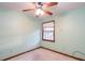 Light and airy bedroom with ceiling fan and window at 714 Lanford Springs Sw Dr, Lilburn, GA 30047