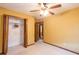 Bedroom with ceiling fan, closet, and door to bathroom at 714 Lanford Springs Sw Dr, Lilburn, GA 30047