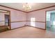 Bright dining room with hardwood floors and chandelier at 714 Lanford Springs Sw Dr, Lilburn, GA 30047