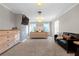 Bright bedroom with neutral carpet, gray walls, a king bed, and seating area with modern furnishings at 180 Paula Dr, Tyrone, GA 30290