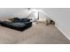 Large bedroom/bonus with neutral carpet, oversized couch, and bed at 180 Paula Dr, Tyrone, GA 30290
