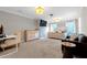 Spacious bedroom with neutral carpet, gray walls, a king bed, dresser and media center at 180 Paula Dr, Tyrone, GA 30290