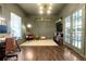 Serene office space featuring dark green walls, hardwood floors, and ample natural light at 180 Paula Dr, Tyrone, GA 30290