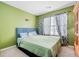 Large bedroom with a king bed and patterned curtains at 104 Northcutt Station Pl, Acworth, GA 30101