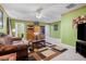 Spacious bonus room with a leather couch and built-in shelving at 104 Northcutt Station Pl, Acworth, GA 30101