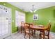 Charming dining room with wood table and chairs, adjacent to the kitchen at 104 Northcutt Station Pl, Acworth, GA 30101