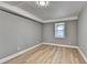 Spacious basement bedroom with gray walls and wood-look flooring at 1900 Mornington Ln, Snellville, GA 30078
