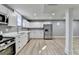 Modern basement kitchen with white cabinets and stainless steel appliances at 1900 Mornington Ln, Snellville, GA 30078