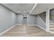 Finished basement with gray walls and wood-look flooring at 1900 Mornington Ln, Snellville, GA 30078