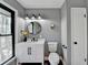 Modern bathroom with a white vanity, black fixtures, and a stylish chevron pattern at 1900 Mornington Ln, Snellville, GA 30078