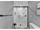 Modern bathroom with a large glass shower and marble tile at 1900 Mornington Ln, Snellville, GA 30078
