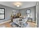 Spacious bedroom with hardwood floors, large windows, and neutral decor at 1900 Mornington Ln, Snellville, GA 30078