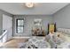 Spacious bedroom with hardwood floors, large windows, and neutral decor at 1900 Mornington Ln, Snellville, GA 30078