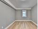 Spacious bedroom with light grey walls and wood-look flooring at 1900 Mornington Ln, Snellville, GA 30078