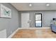 Bright entryway with hardwood floors and modern white door at 1900 Mornington Ln, Snellville, GA 30078