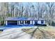Ranch style home with attached two-car garage and landscaped yard at 1900 Mornington Ln, Snellville, GA 30078