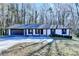 Ranch style home with a two-car garage and landscaped yard at 1900 Mornington Ln, Snellville, GA 30078