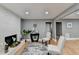 White brick fireplace in living room with hardwood floors at 1900 Mornington Ln, Snellville, GA 30078