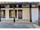 Inviting front porch with black door and white brick exterior at 1900 Mornington Ln, Snellville, GA 30078