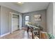 Bright home office features hardwood floors, built-in shelving, and large windows at 1900 Mornington Ln, Snellville, GA 30078